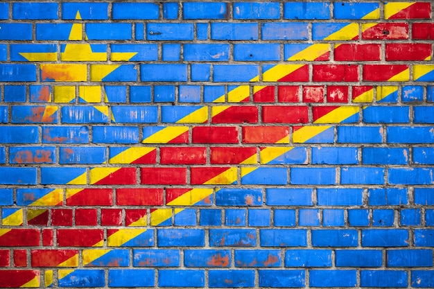 National flag of the Democratic Republic of the Congo on a grunge brick background