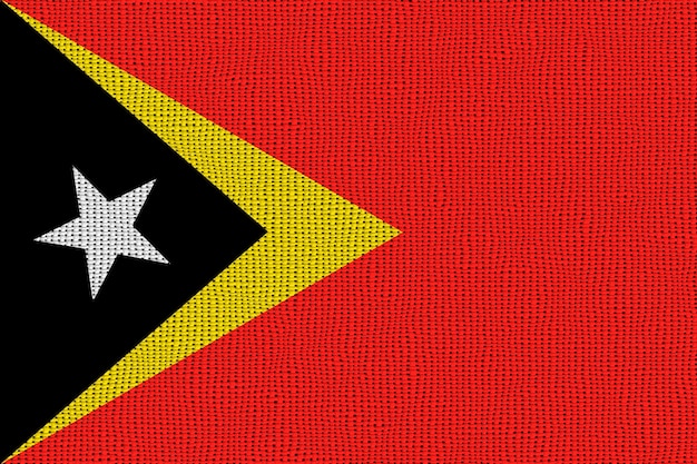 Foto bandiera nazionale di timor est sfondo con bandiera o di timor est