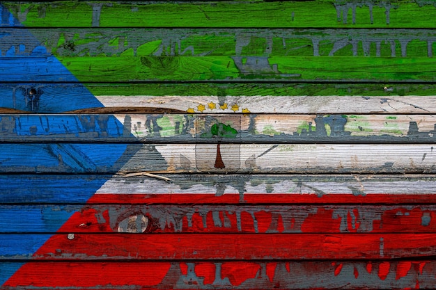 The national flag of Equatorial Guinea is painted on uneven boards Country symbol