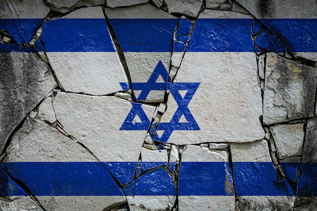 National flag of Israel
 depicting in paint colors on an old stone wall Flag  banner on broken  wall background