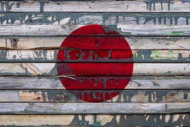 The national flag of Japan is painted on uneven boards Country symbol