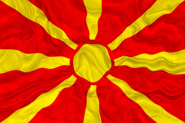 Foto bandiera nazionale della macedonia sfondo con bandiera della macedonia