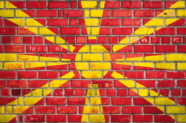 National flag of the Macedonia on a grunge brick background