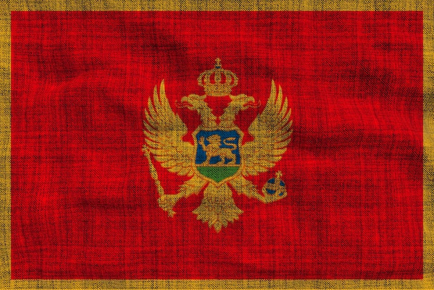 Foto bandiera nazionale del montenegro sfondo con bandiera del montenegro