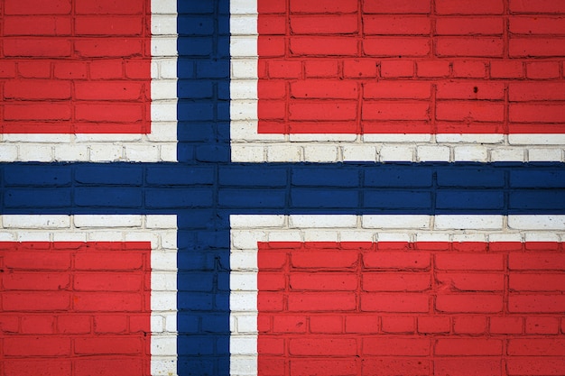 National flag of Norway depicting on an old brick wall