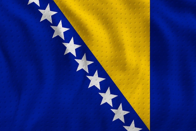 Foto bandiera nazionale della bosnia ed erzegovina sfondo con bandiera della bosnia ed erzegovina