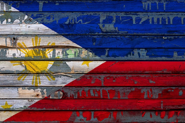 The national flag of Philippines is painted on uneven boards Country symbol