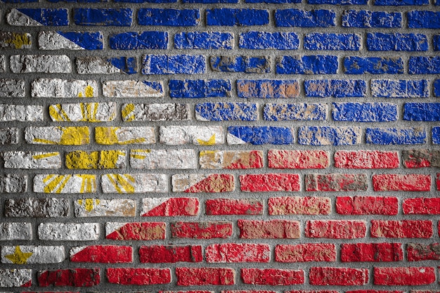 National flag of Philippines on an old brick wall