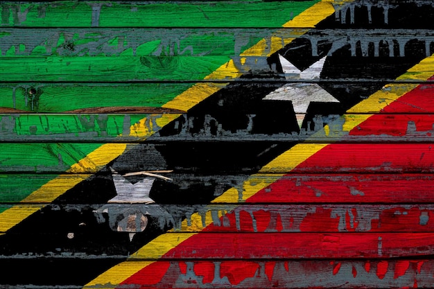 The national flag of Saint Kitts and NevisxA is painted on uneven boards Country symbol
