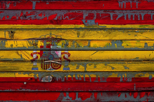 The national flag of SpainxA is painted on uneven boards Country symbol