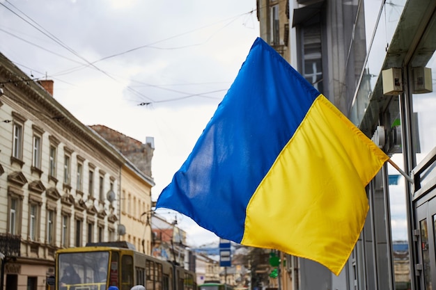 The national flag of Ukraine flutters in the wind Lviv during war