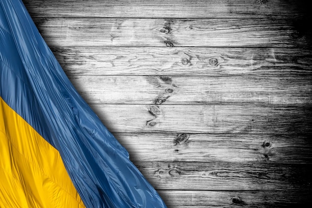 National flag of Ukraine isolated on wooden background