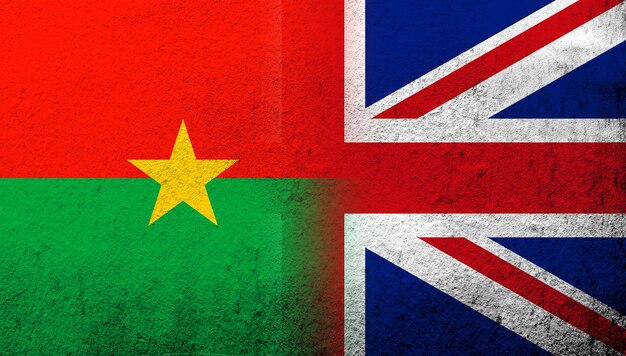 National flag of united kingdom great britain union jack with national flag of burkina faso grunge background