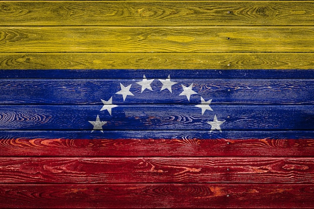 The national flag of VenezuelaxA is painted on a camp of even boards nailed with a nail The symbol of the country