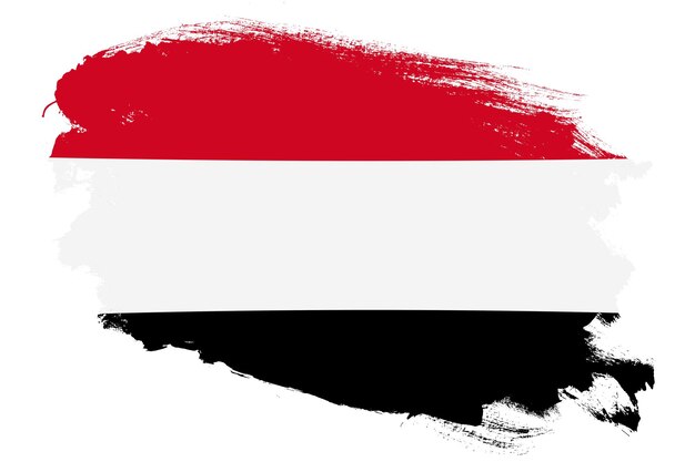 National flag of Yemen on grunge stroke brush textured white background