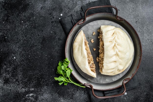 National Korean fast food steamed pies pyanse Pyanse with vegetable and meat Black background Top view Copy space