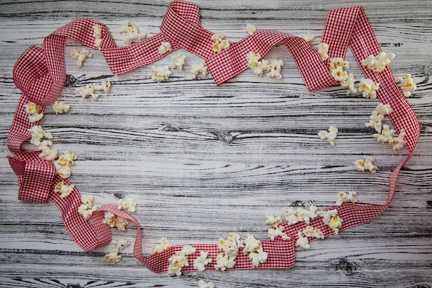 National Popcorn Day concept Festive red ribbon background View from above Vintage style