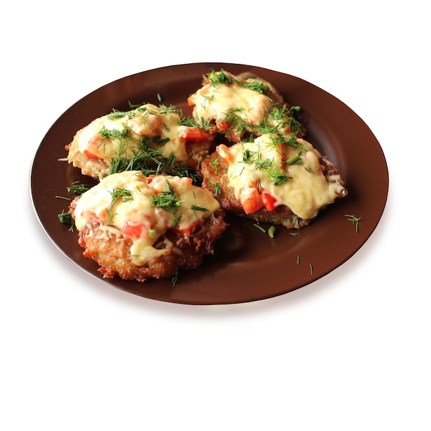 National Ukrainian dish potato pancake with tomato under melted cheese