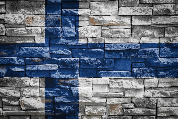 Nationale vlag van Finland op stenen muur achtergrond