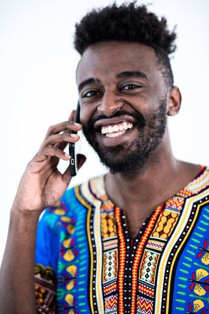 native sudan african male using smart phone isolated on white background