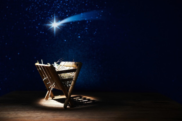 Nativity of jesus empty manger at night with bright lights