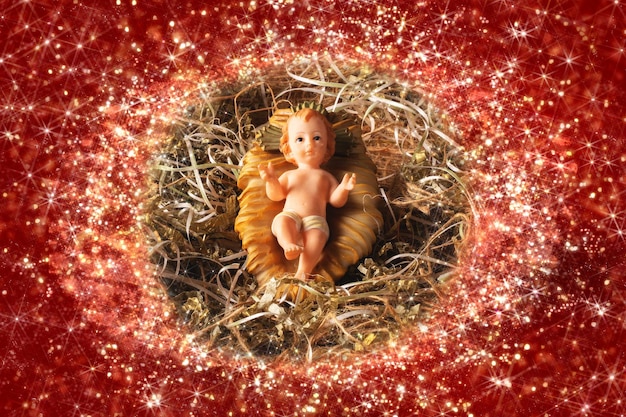 La figura di gesù bambino del presepe ha isolato la scena di natale tradizionale