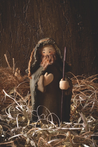 Nativity scene. Isolated figures with rustic background.