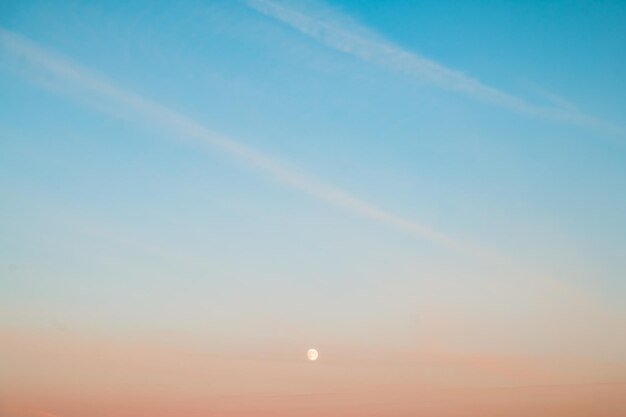 Natural background beautiful sunrise sky with full moon