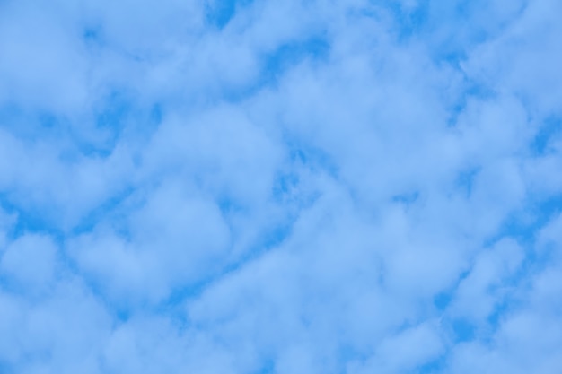 Natural background, cloudscape - blue sky with light cumulus clouds