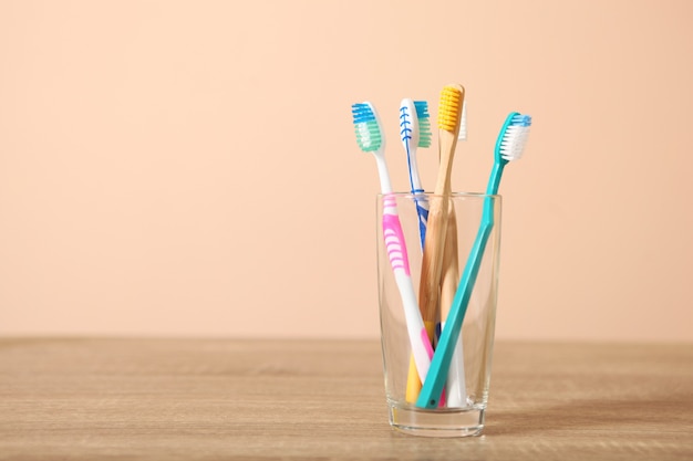 Natural bamboo and plastic toothbrushes on the table