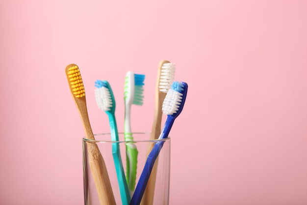 Natural bamboo and plastic toothbrushes on the table