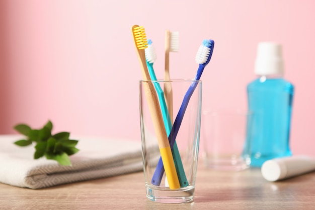 Natural bamboo and plastic toothbrushes on the table