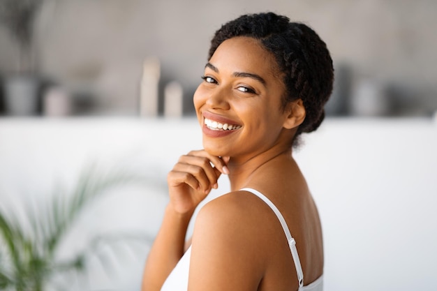 Natural beauty attractive black woman touching chin and looking at camera