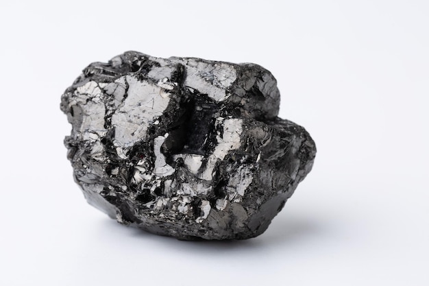 Natural black fossil coal on a white isolated background