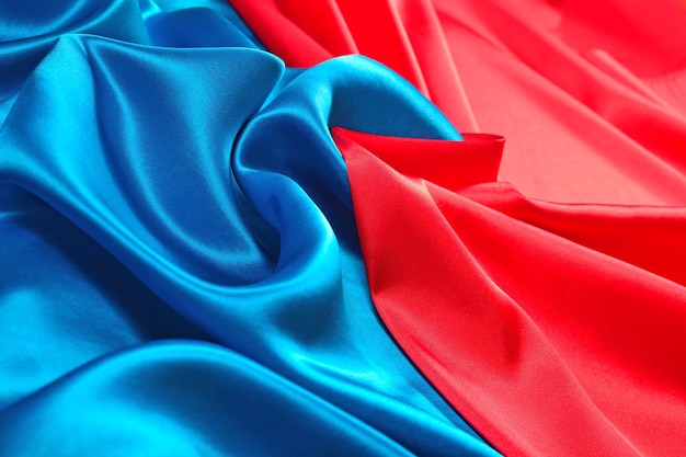 Фото Натуральная синяя и красная текстура атласной ткани