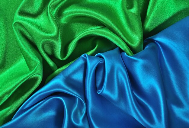 Natural blue and green satin fabric as background texture