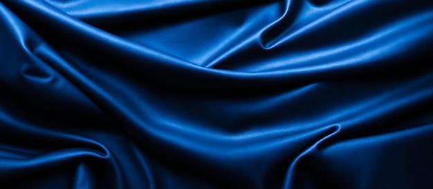 натуральная текстура синей кожи волнистые складки синяя кожа материал фона синяя скрученная кожа синяя ткань фона с складками