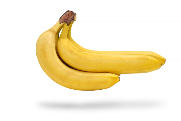 Естественная связка бананов на белой предпосылке. Изолированные.