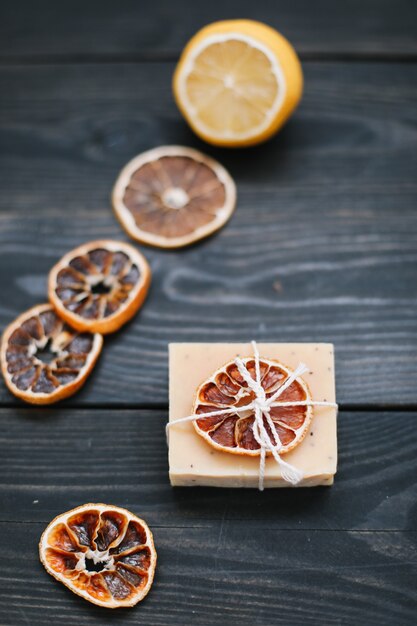 Natural citrus soap on dark surface