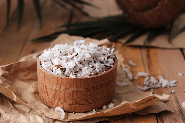 Natural coconut flakes on the table closeup