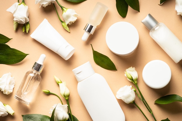 natural cosmetic products cream serum tonic with green leaves and flowers skin care concept