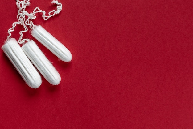 Natural eco female tampons on a red background