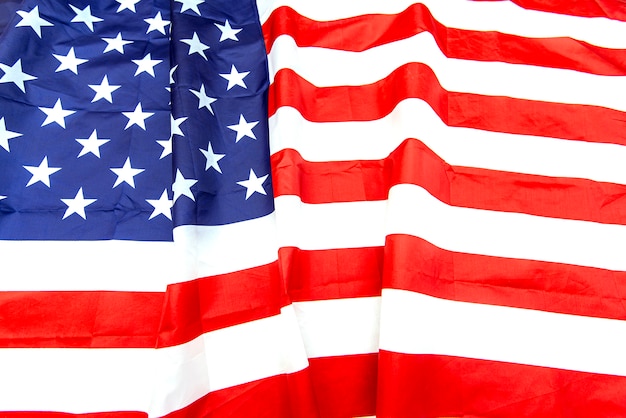 Natural fabric crumpled USA flag, rag American flag top view 