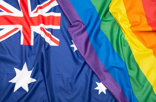 Natural fabric Flag of Australia and LGBT Rainbow flag as texture or background, concept picture about human rights