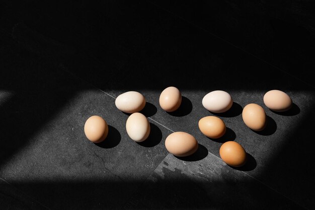 Natural farm chicken eggs isolated on dark background Easter holiday concept