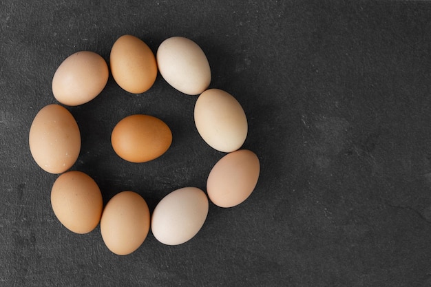 Natural farm chicken eggs isolated on dark background Easter holiday concept