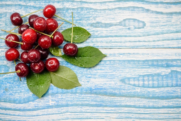 Natural garden cherry berries on a wooden background the concept of natural grown products