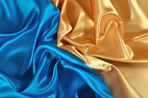 Natural golden and blue satin fabric as background texture