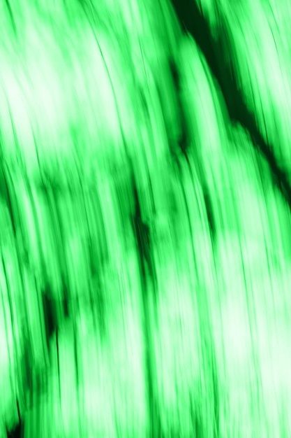 自然な緑のぼやけた焦点ぼけダイナミック抽象的な背景緑の高速スピーディーなモーションブラーの背景