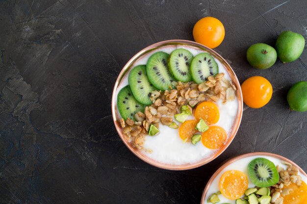 Natural healthy yogurt with muesli and fruit.